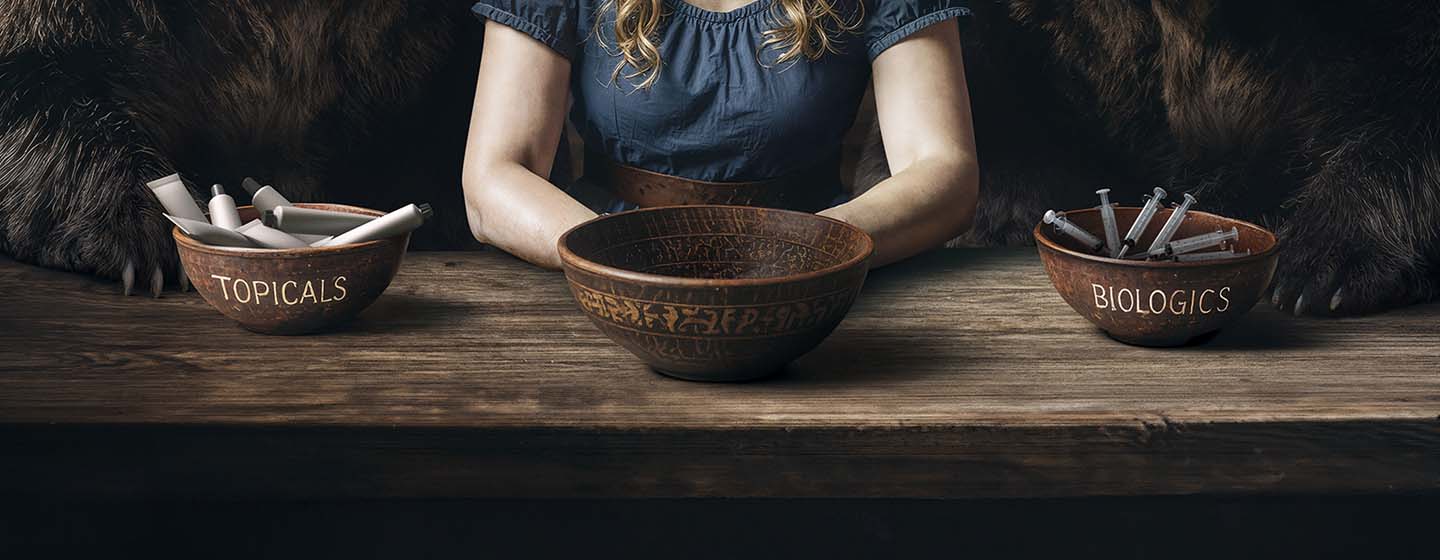 Close up of woman sitting beside two bears at a table with bowls of topicals and biologics in front of them